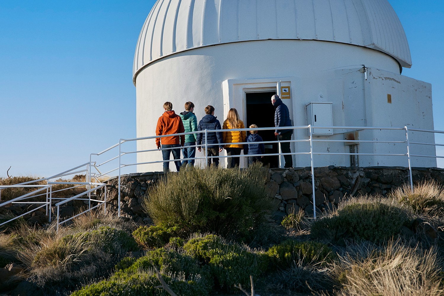 Private group entering the visitor center to participate in a workshop on astrophysics