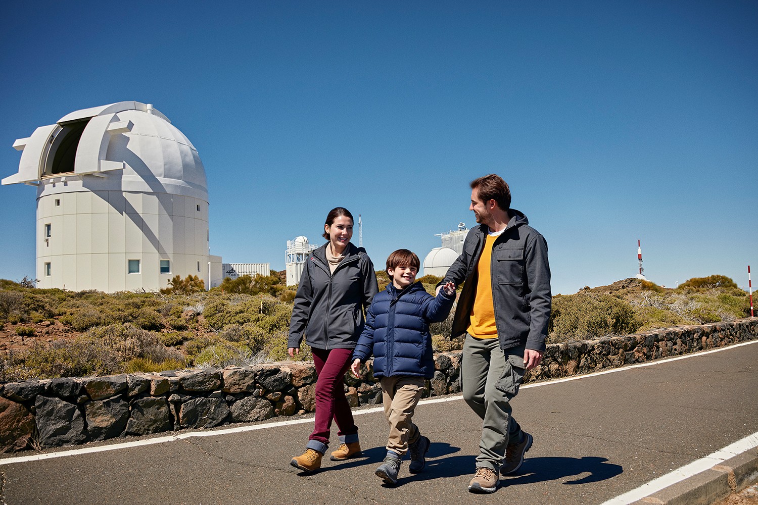 Family enjoying the exclusive daytime guided tour of the Teide Observatory