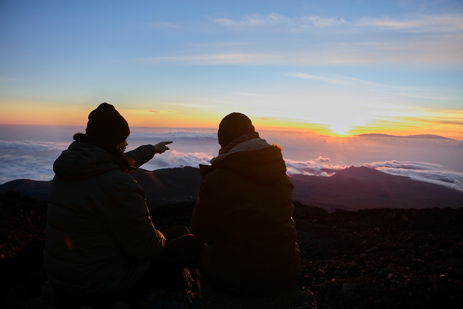 Couple enjoying the sunset during their walk along the path after the Cable car ride