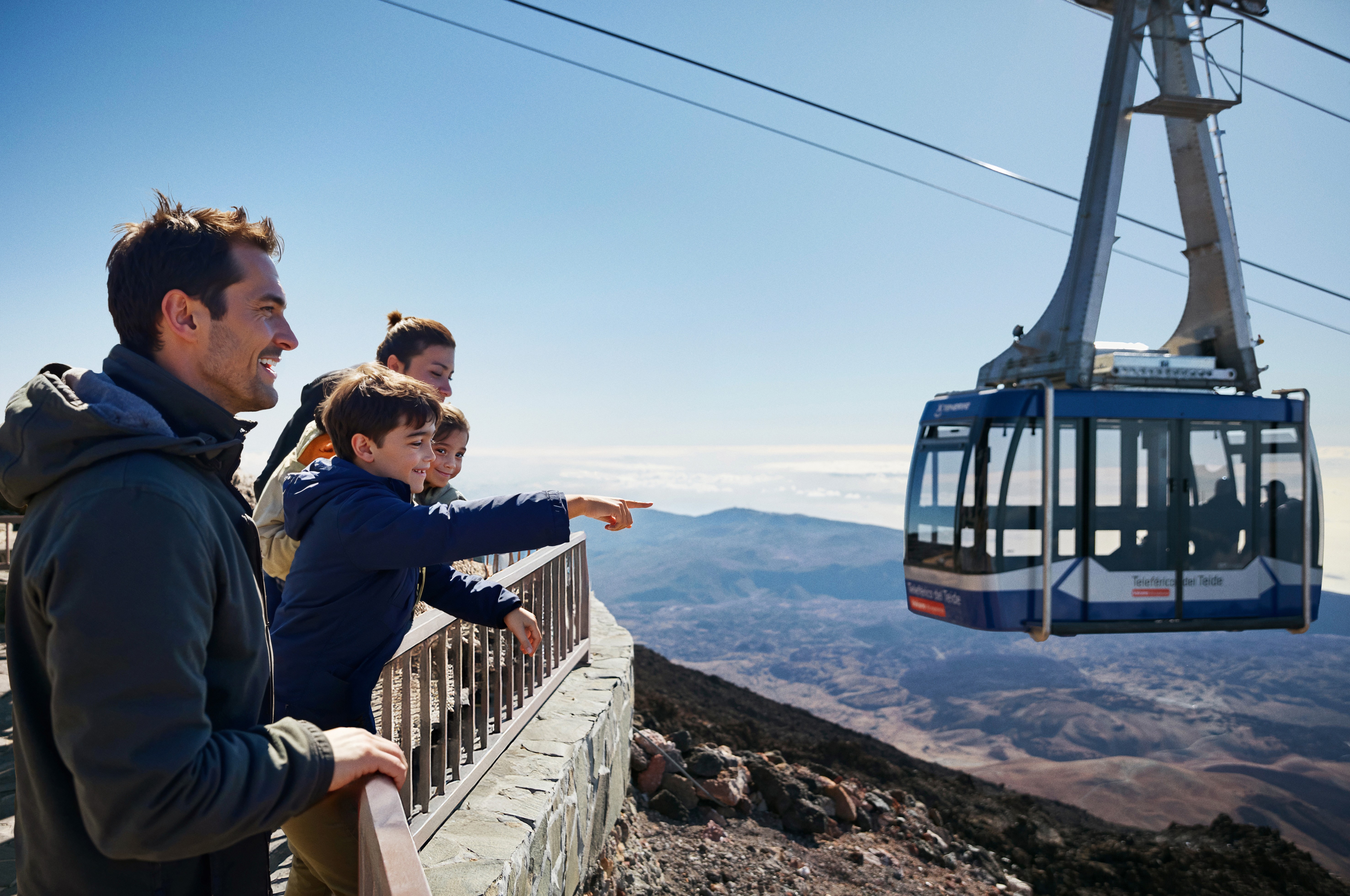 Family observing the views as soon as they reach the top of the Teide Cable Car