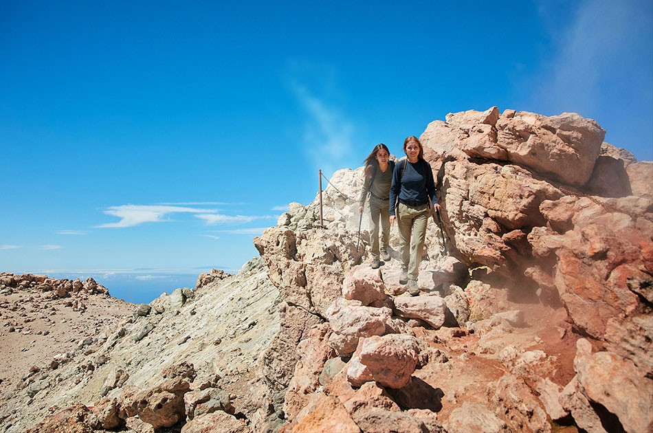 Girls observing the fumaroles at the summit of Mount Teide