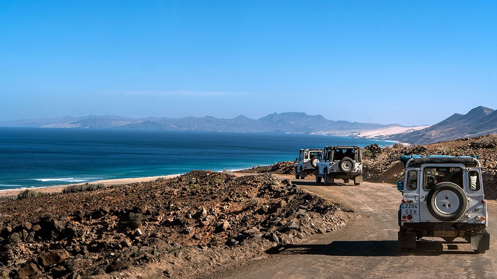 Vehicles en route to visit Cofete beach by Jeep Safari