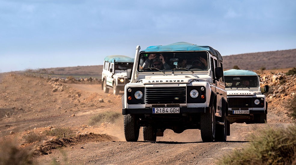 Caravan of vehicles on a Jeep Safari excursion in Lanzarote